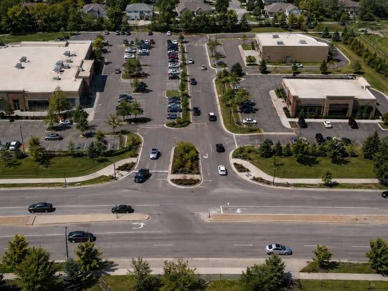 Shared site entrance designed for multiple commercial properties with improved traffic flow