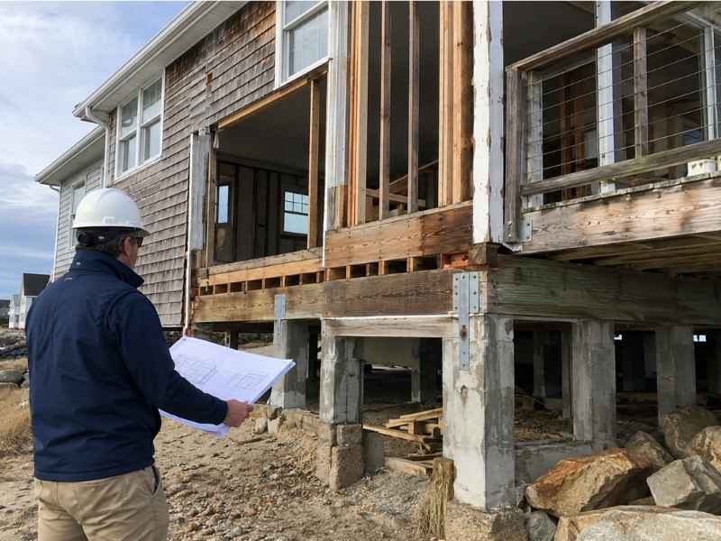 Structural engineer inspecting framing, connections, and foundation conditions during a coastal renovation in Pensacola, Florida.